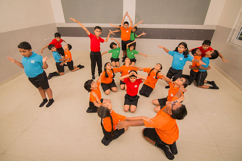 students indoor group dance - Suguna International School