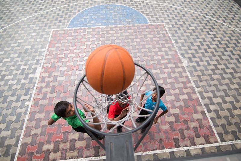 basketball playing image - Suguna International School